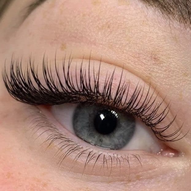 Girl's eye with eyelash extensions, classic lash by lash, 1.5D.