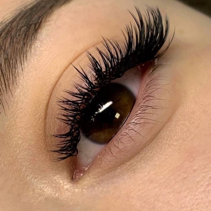 Woman's eye with eyelash extension, 3D volume.