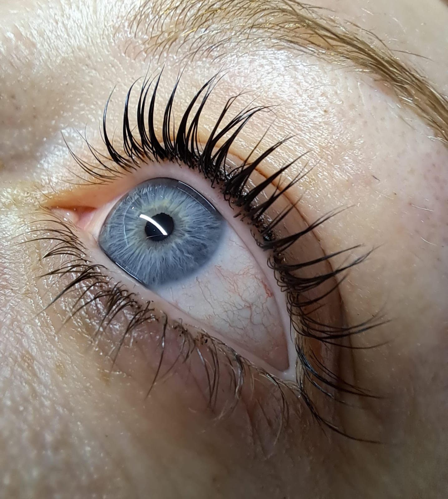 A wider eye after a lash lift done by a trainee during the course
